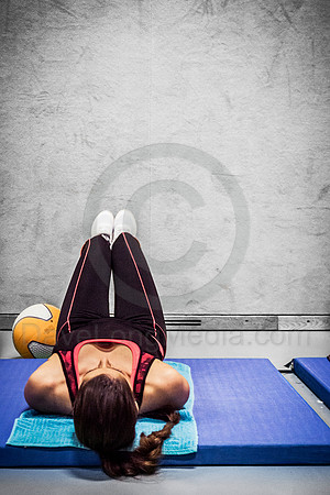 Young Woman Doing Leg Exercises at the Gym
