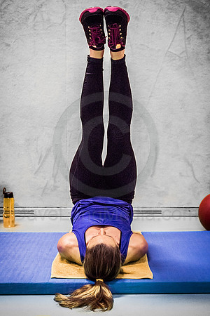 Young Woman Doing Leg Exercises at the Gym