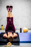Young Woman Doing Leg Exercises at the Gym