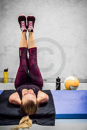 Young Woman Doing Leg Exercises at the Gym