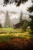 Cabin in the Alps on Misty Morning