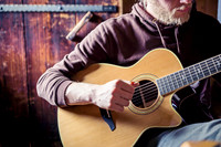 Young Man Playing Acoustic Guitar