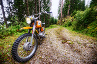 Dirt Bike and Winding Road in the Alps