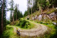 Dirt Bike and Winding Road in the Alps