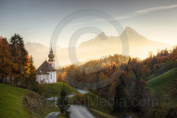 Sunset in the Bavarian Alps with remote church