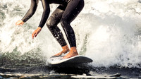 Woman River Surfing in the Alps