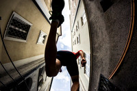 Runner Leaps Over Camera in City
