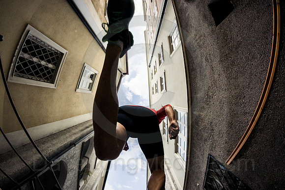 Runner Leaps Over Camera in City