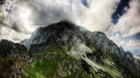 Cable Car Ascending to Alpine Peak
