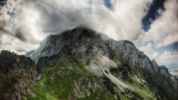 Cable Car Ascending to Alpine Peak