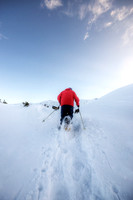 Man Running in Snowshoes High in the Alps