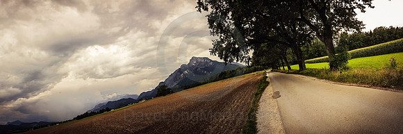 Rural Alpine Panorama under Dramatic Sky