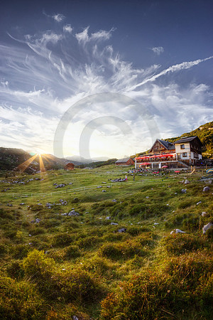 Sunset Over Alpine Lodge in Austria